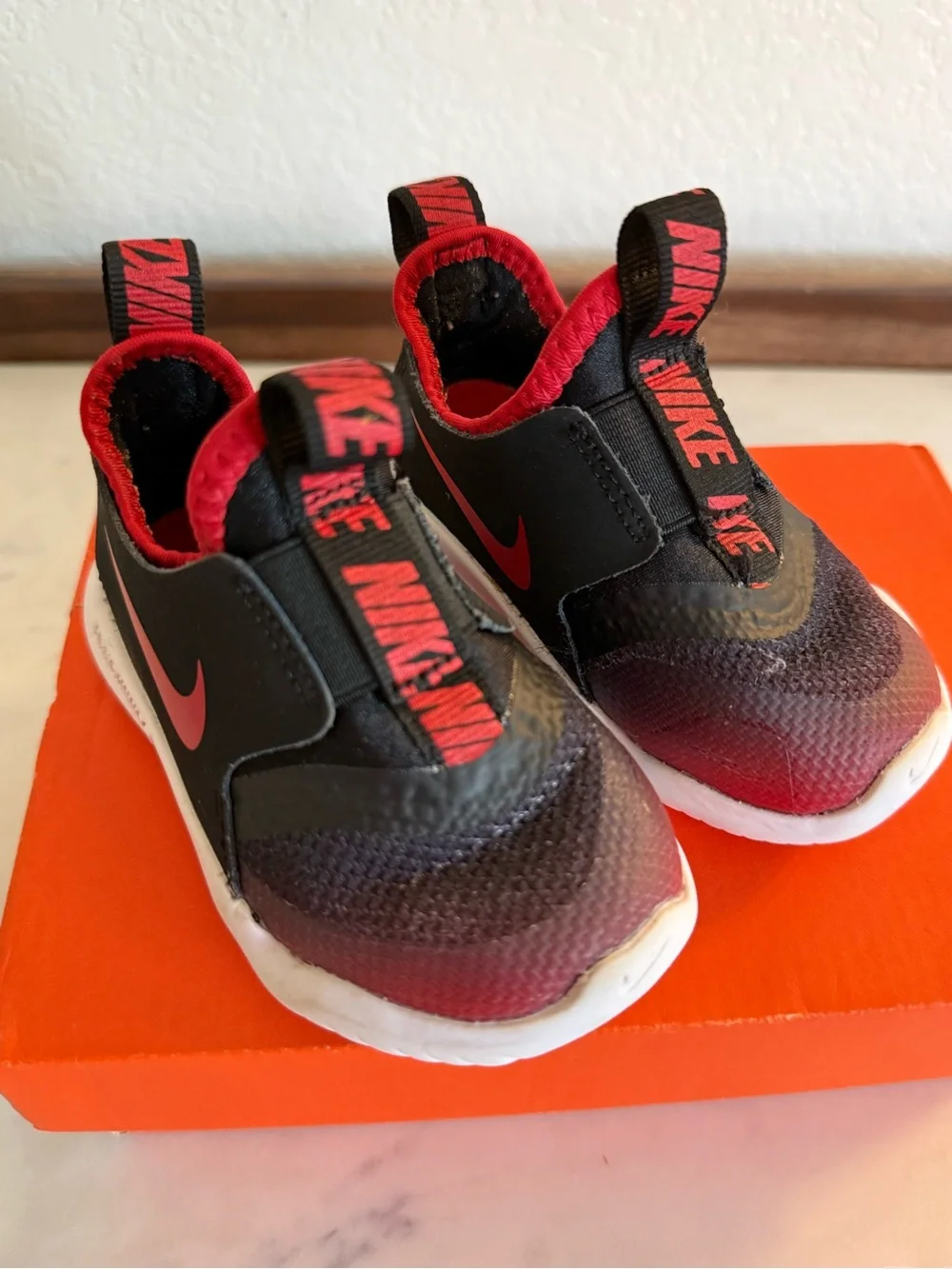 Nike Kids Black and Red Slip-On Sneakers with White Sole
